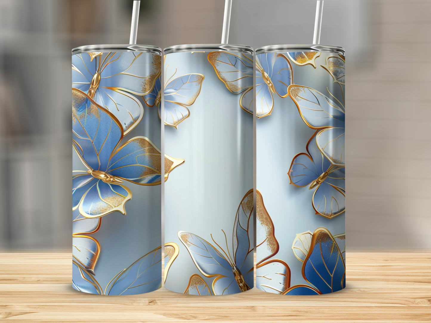 Three tumblers with blue and gold butterfly pattern.