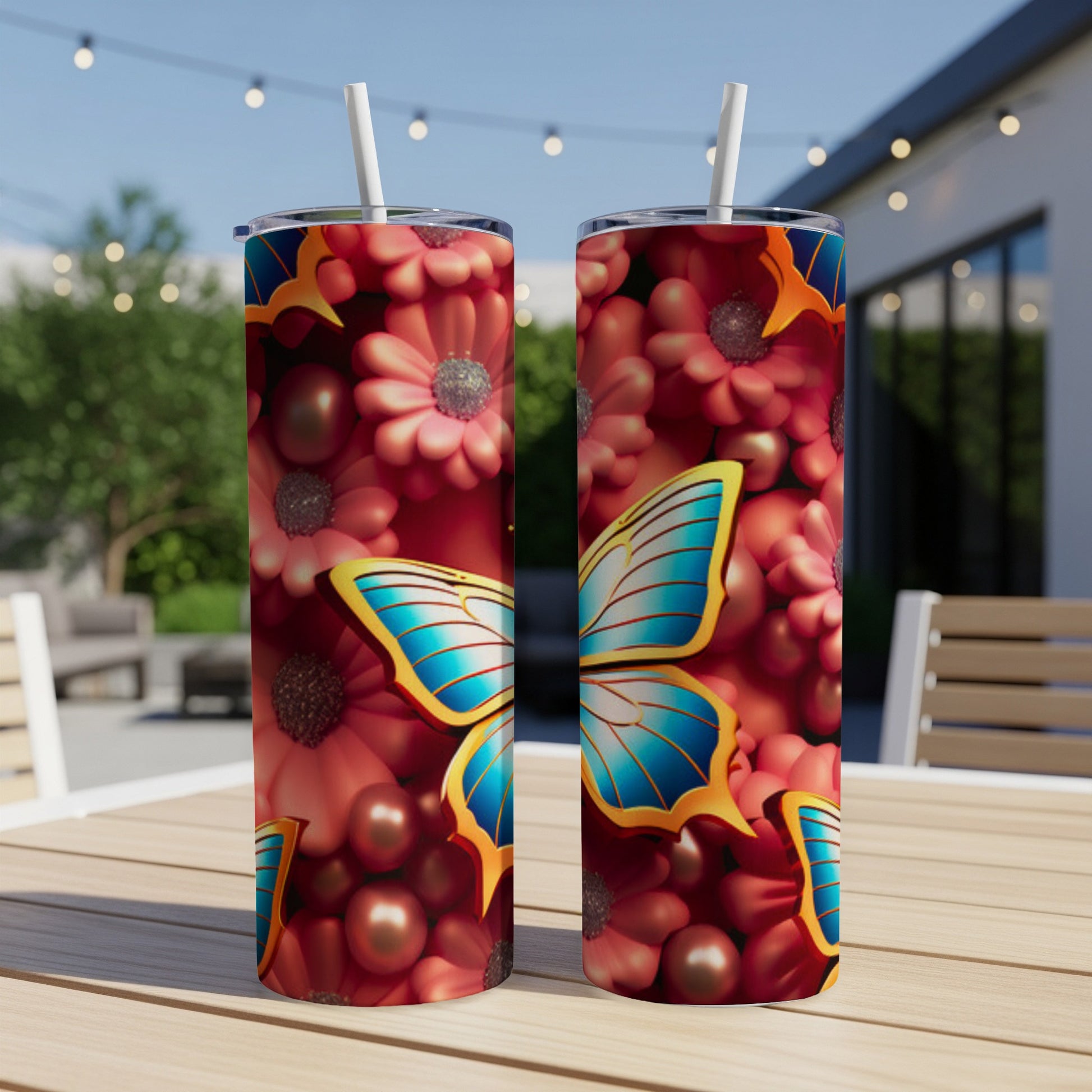 Two tumblers with a blue butterfly and red floral pattern.