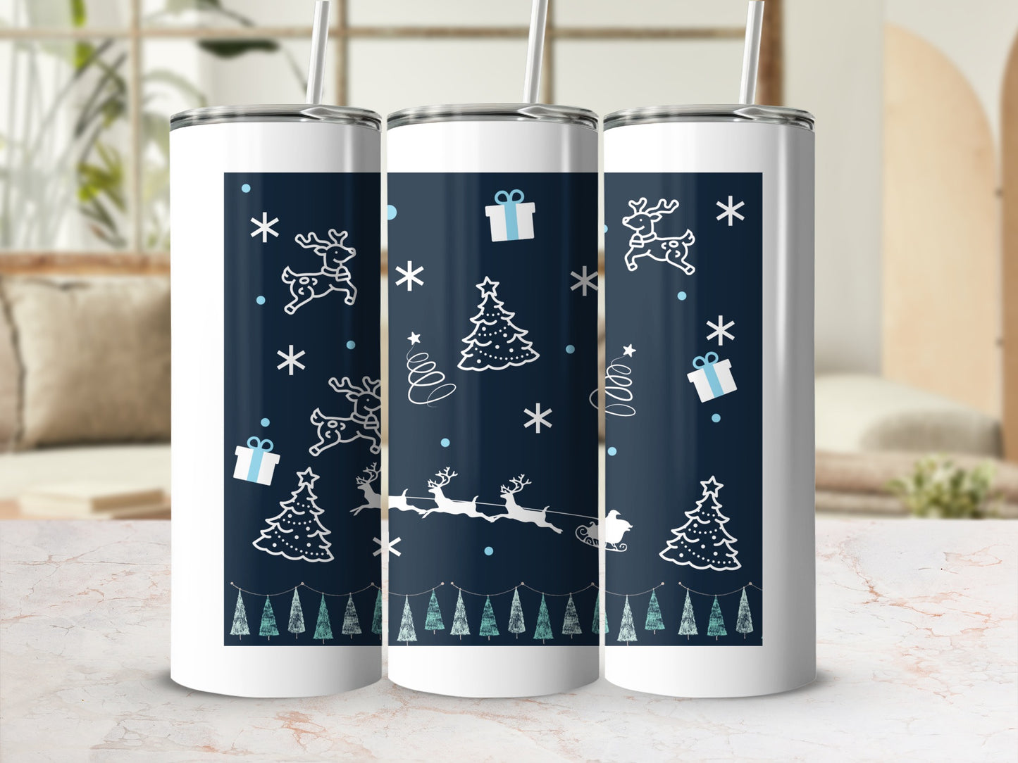 Three white tumblers with a dark blue Christmas design.