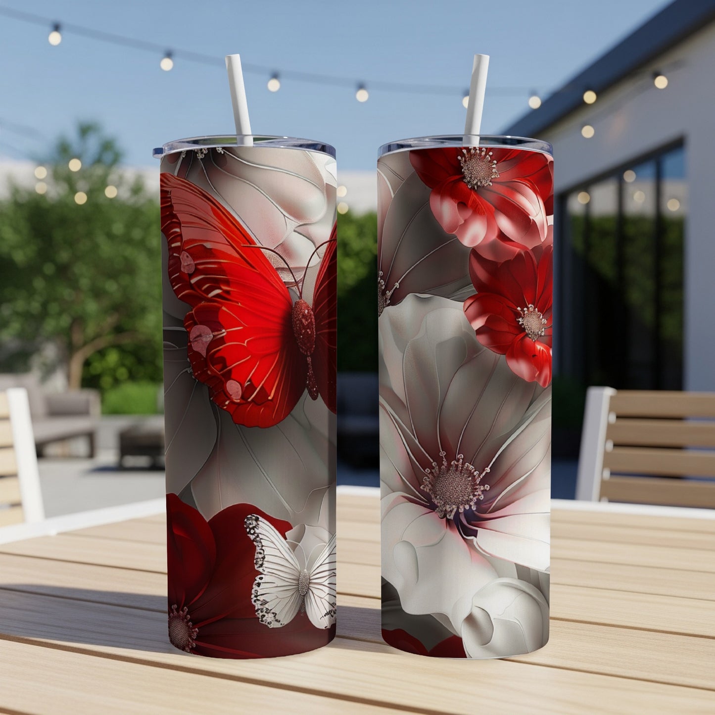 Two tumblers with red and white butterfly and floral designs.