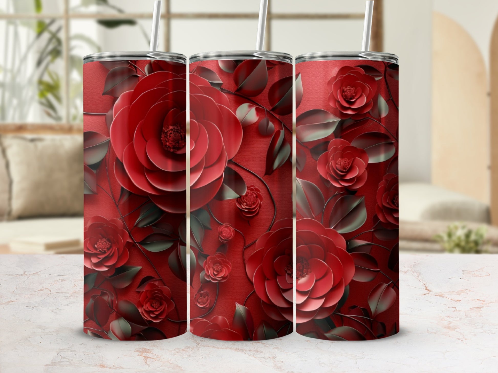 Red floral pattern on a tumbler with a straw.