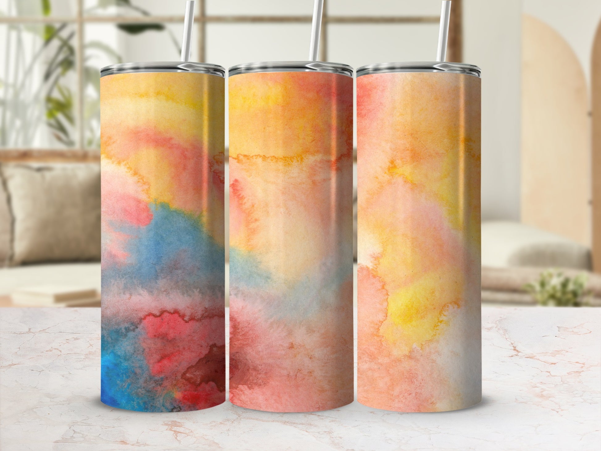 Three tumblers with abstract watercolor patterns in warm, muted tones.