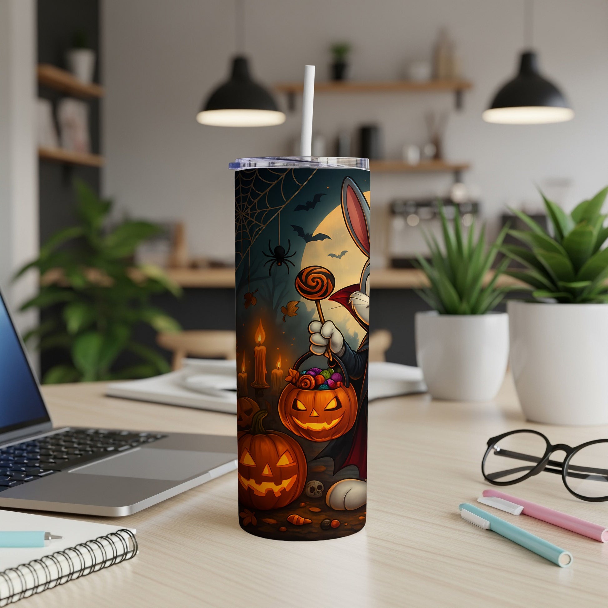 Halloween tumbler with cartoon vampire bunny, jack-o'-lanterns, and candy.