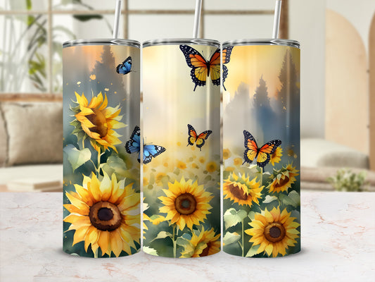 Three sunflowers with butterflies and a sunset background on tumblers.