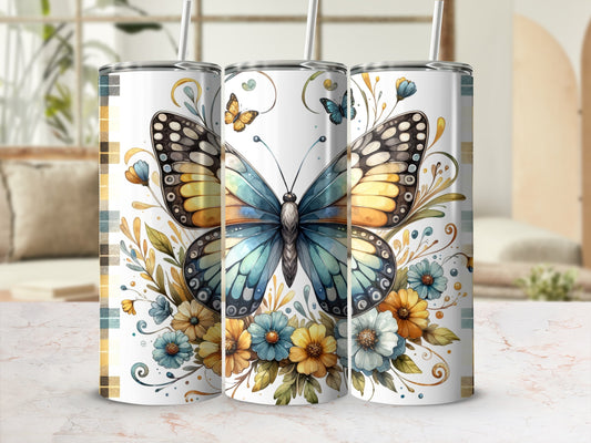 Butterfly and floral design on three white tumblers with straws.