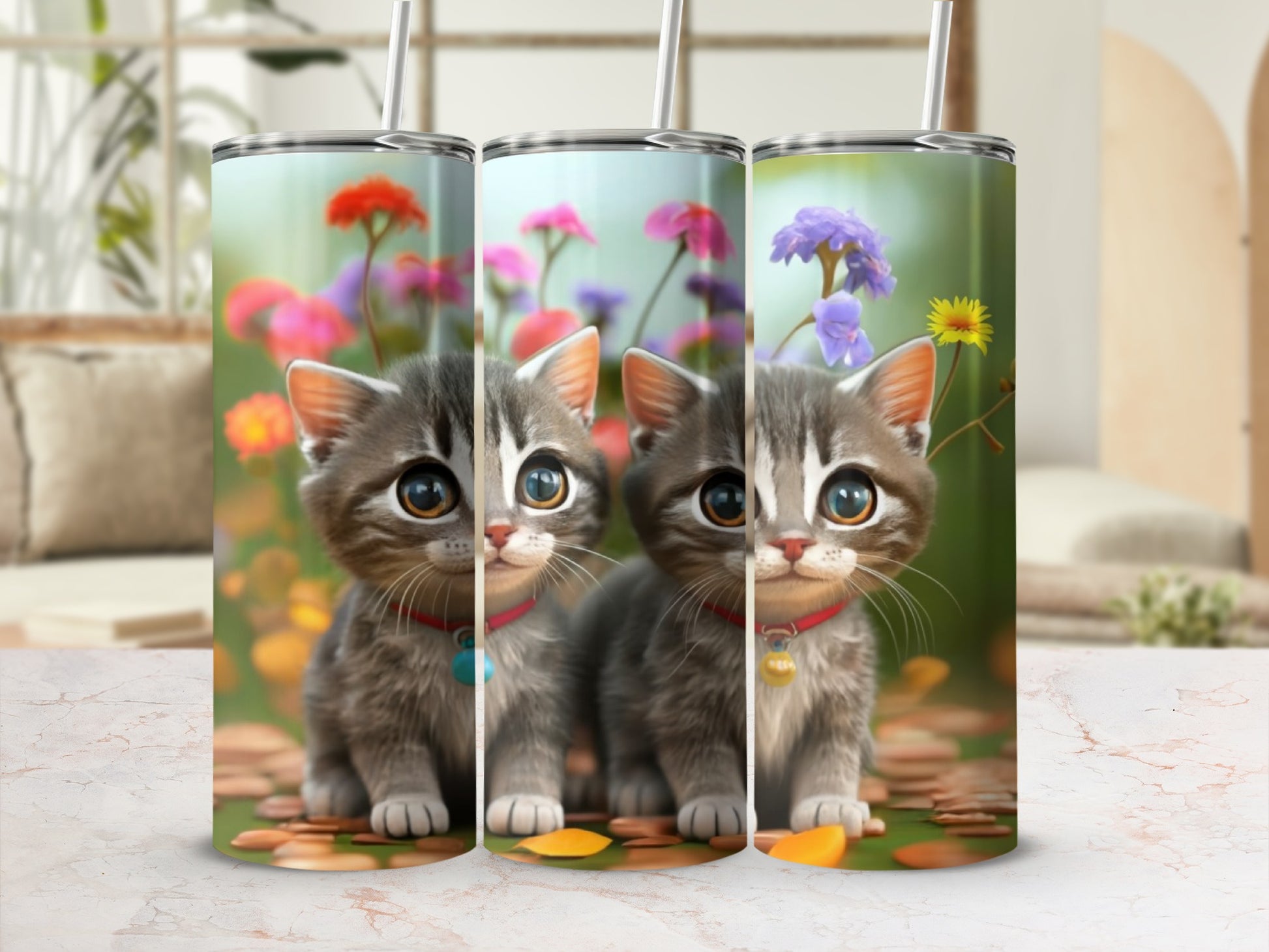 Three tumblers with cartoon kittens sitting in a field of flowers.