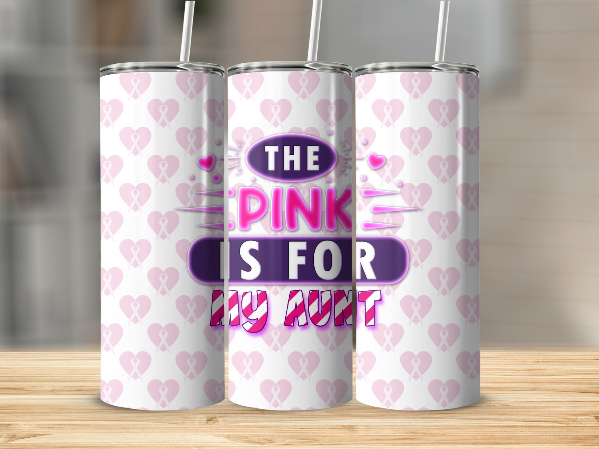 Pink tumbler with "The Pink is for my Aunt" text and ribbon pattern.