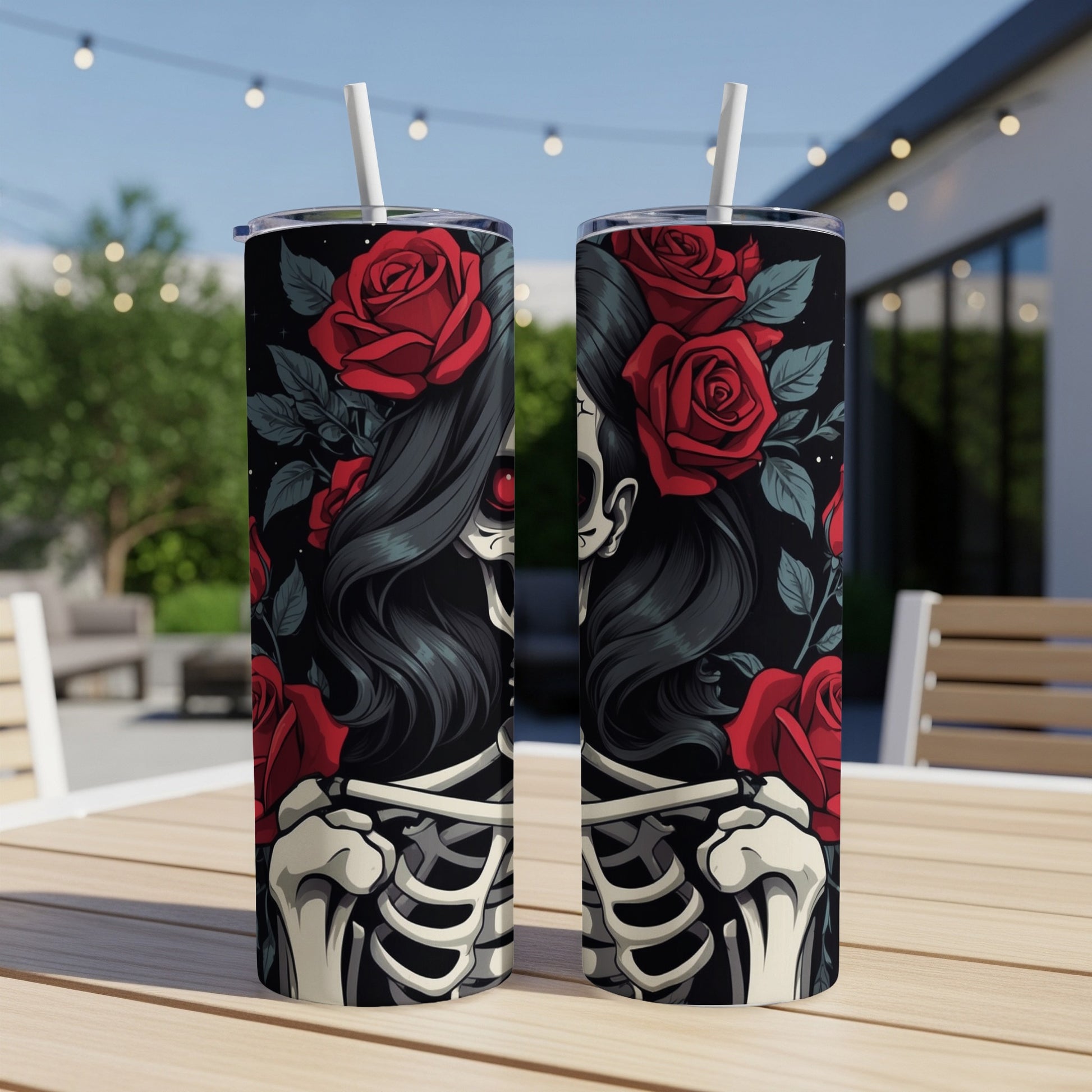 Sugar skull design with red roses and skeleton bones on a tumbler.