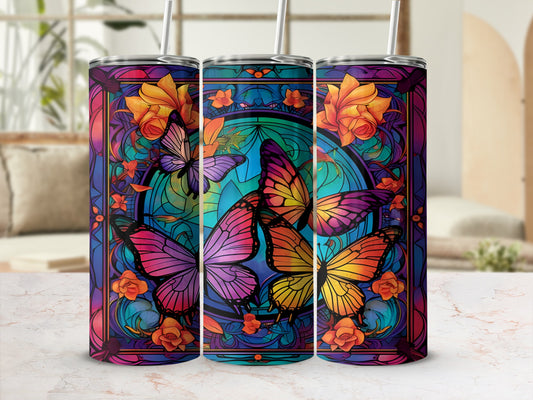 Three stained glass tumblers featuring colorful butterflies and floral patterns.
