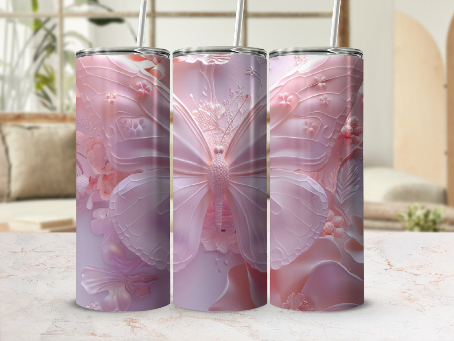 Pink butterfly and floral textured tumbler with straw.