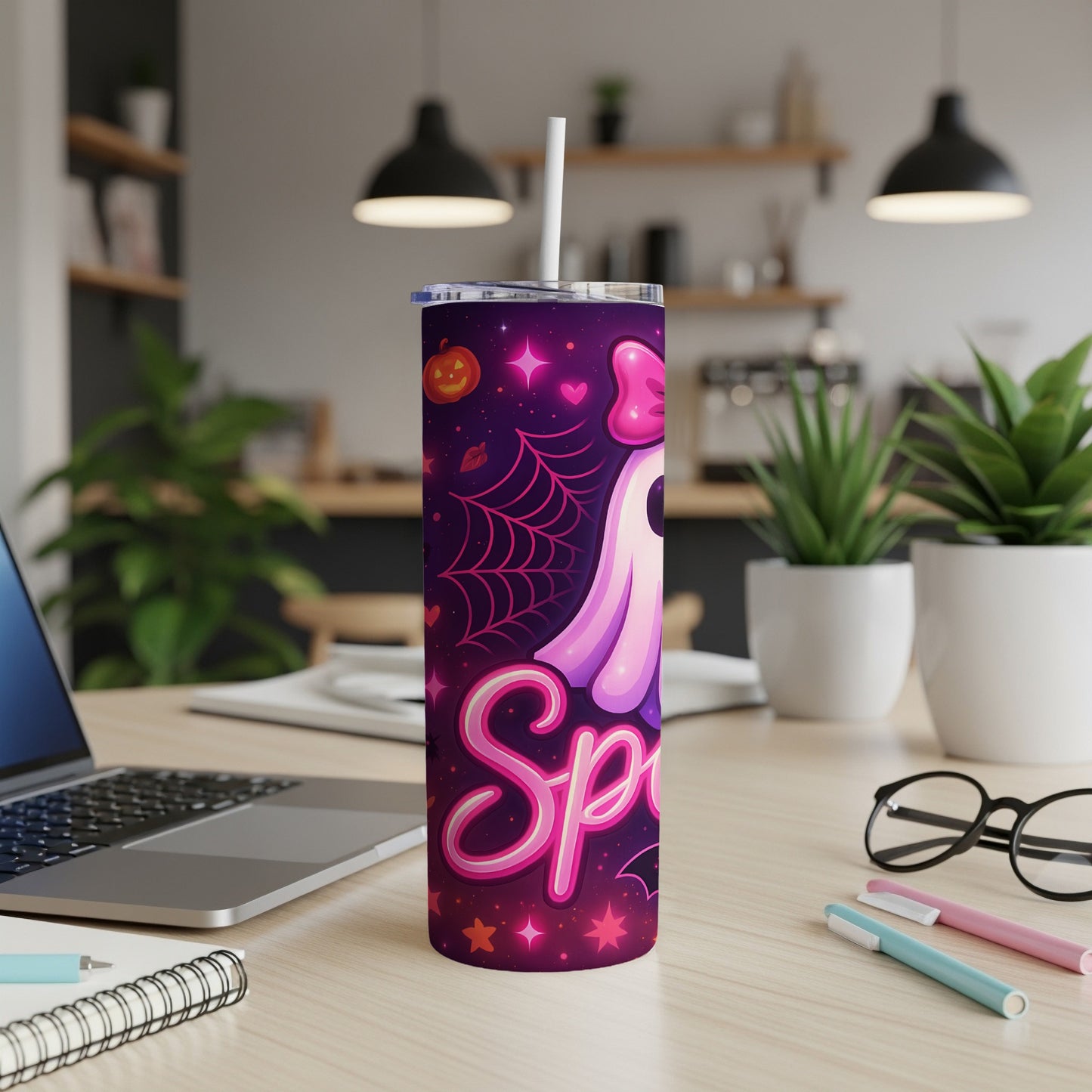 Purple tumbler with pink ghost and "Spooky" text, Halloween theme.
