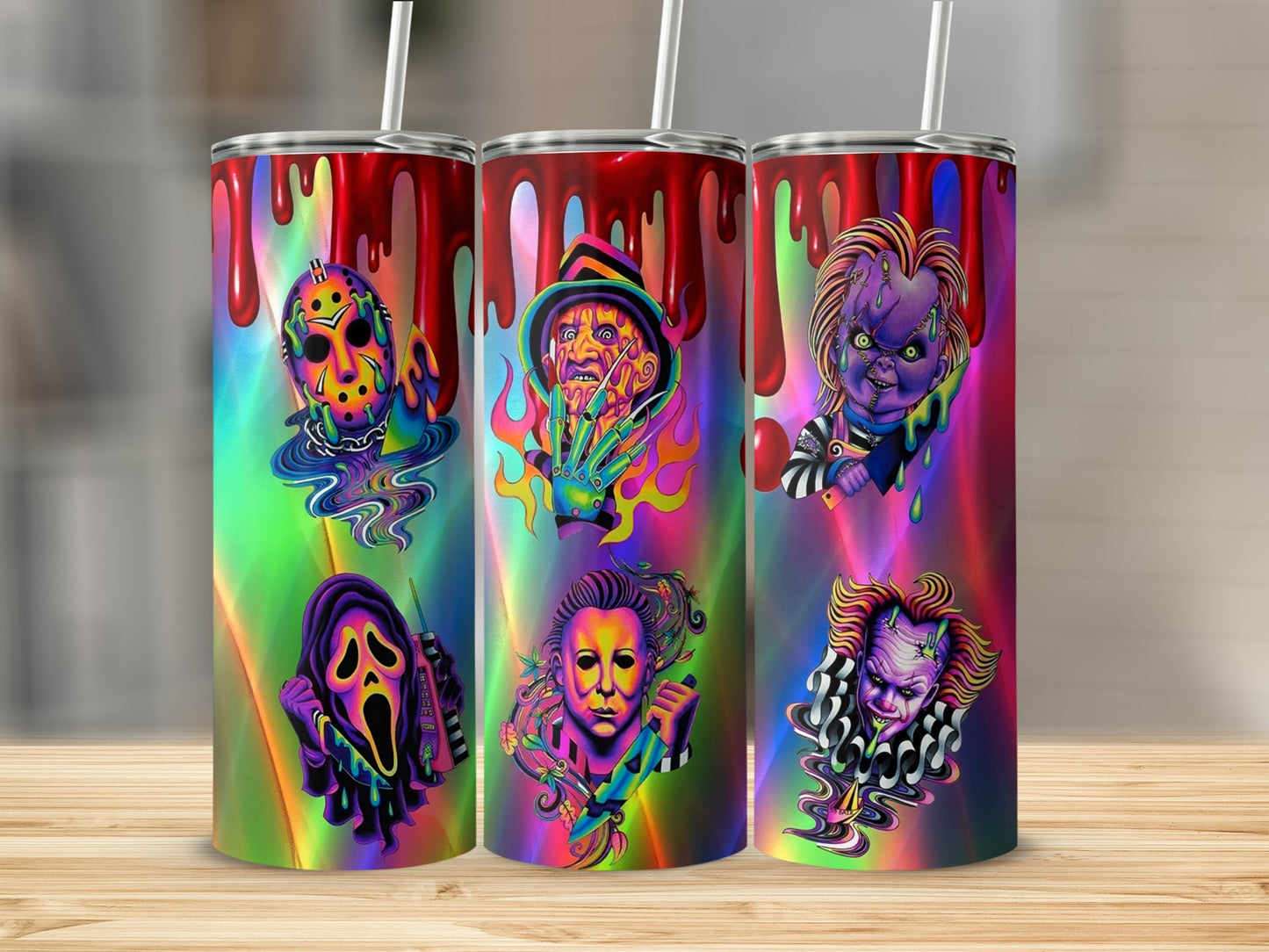 Three tumblers featuring horror movie villains with a colorful, dripping design.