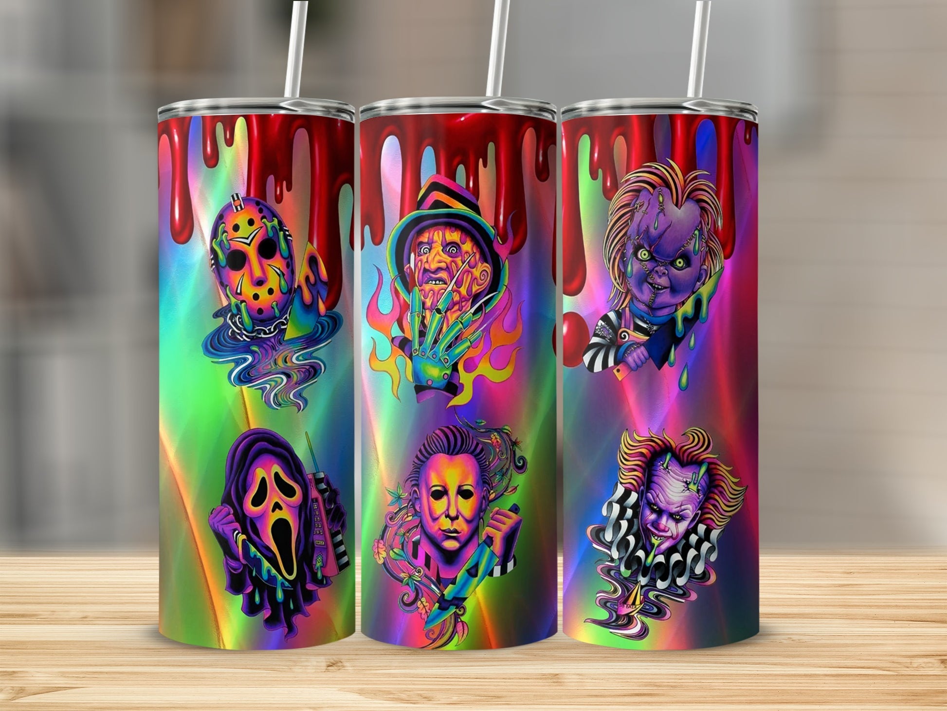 Three tumblers featuring horror movie villains with a colorful, dripping design.