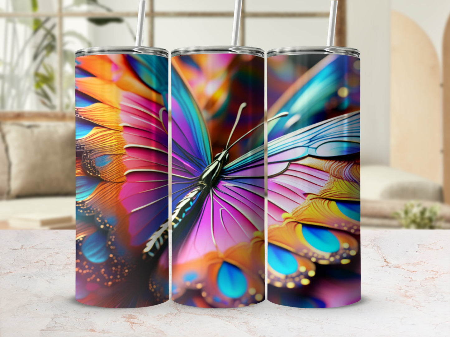 Three tumblers featuring a vibrant, colorful butterfly wing design.