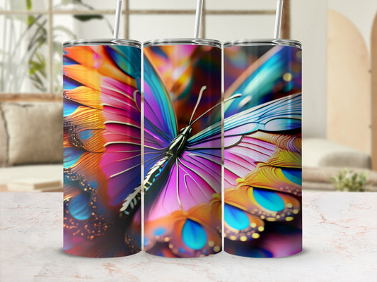 Three tumblers featuring a vibrant, colorful butterfly wing design.