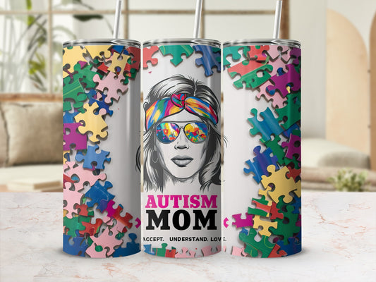 Autism Mom tumbler with puzzle pieces and sunglasses.