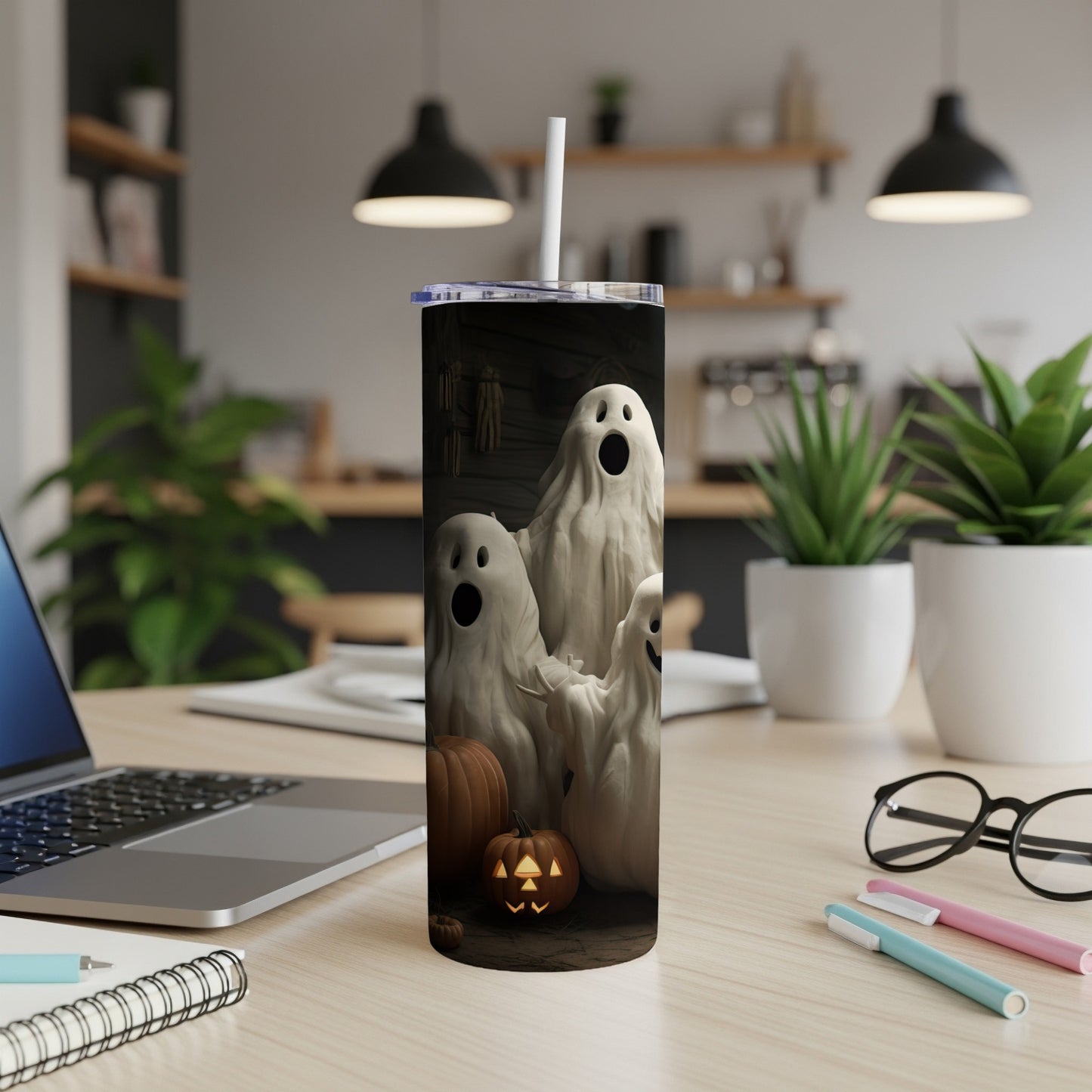 Tumbler with playful ghosts and a jack-o'-lantern against a dark, rustic background.