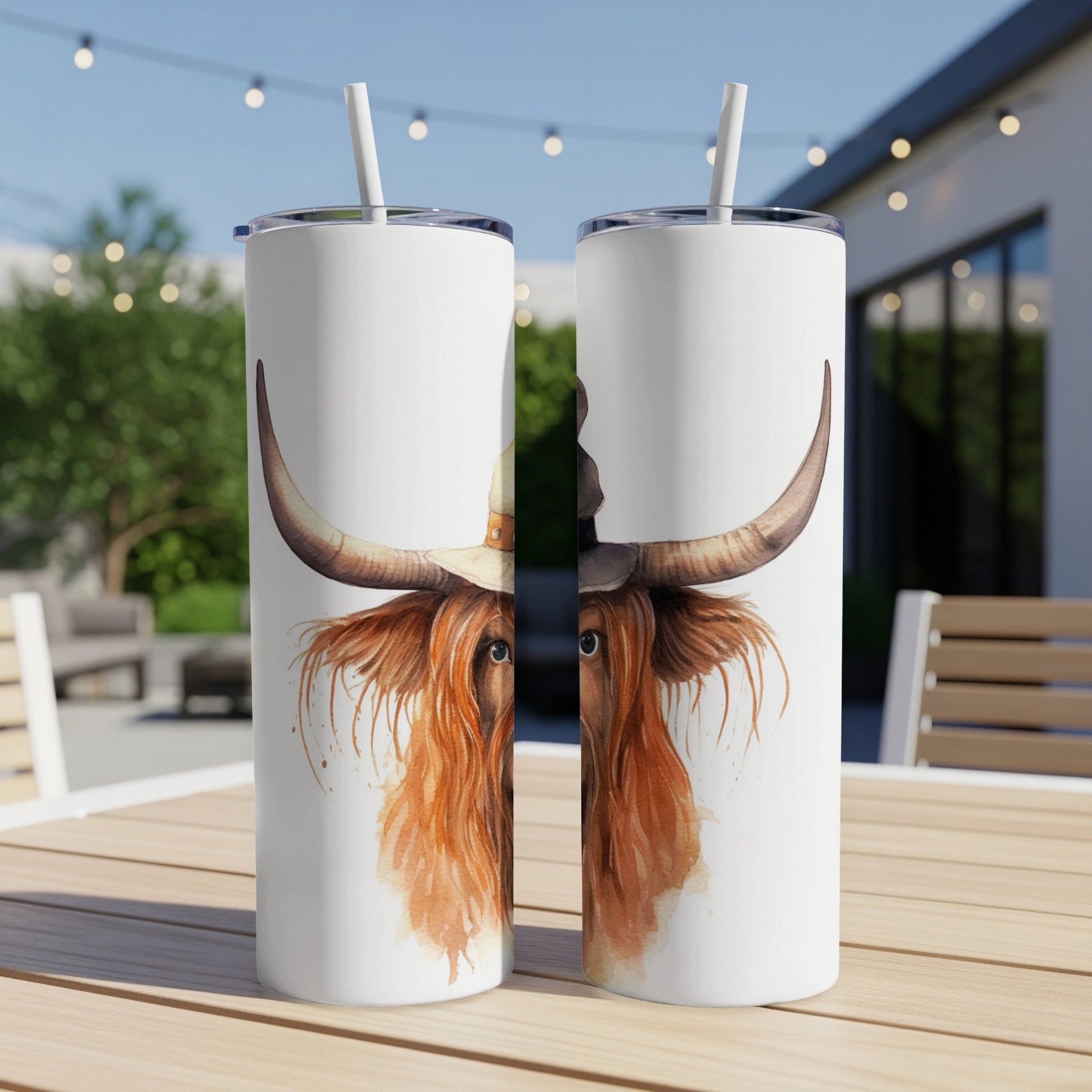 Two tumblers with a watercolor Highland cow wearing a witch hat.