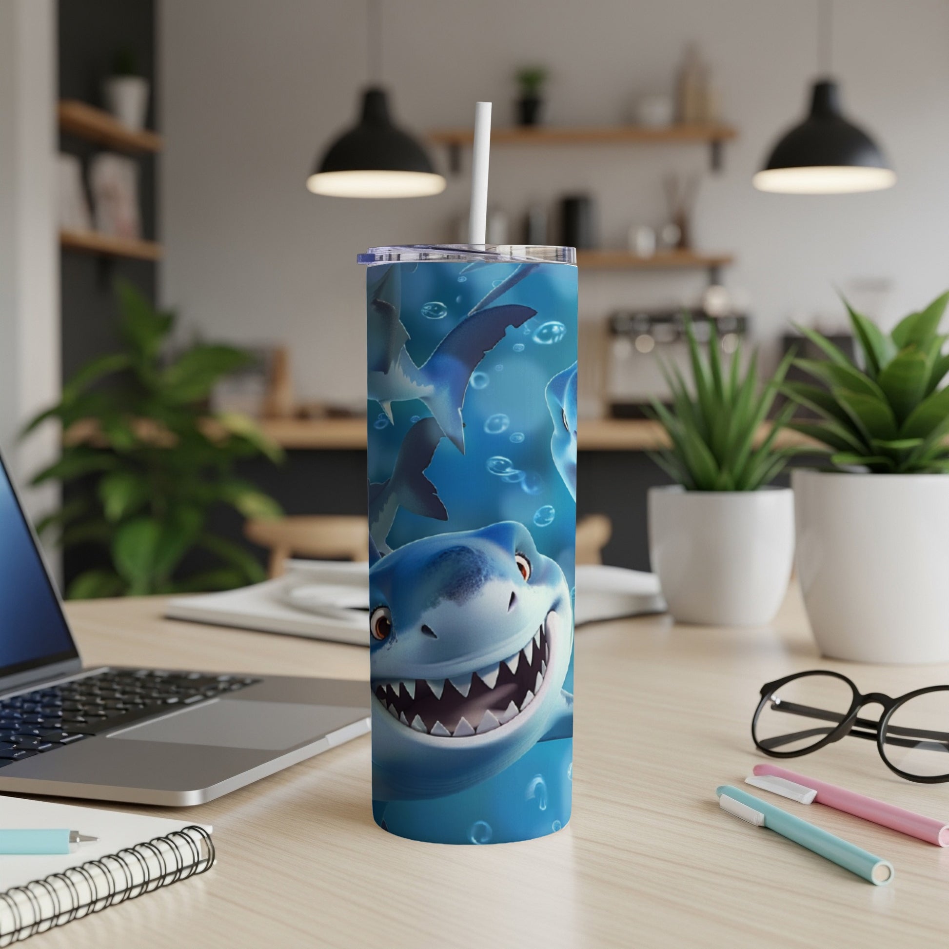 Cartoon shark characters swim around a blue tumbler cup with a straw.