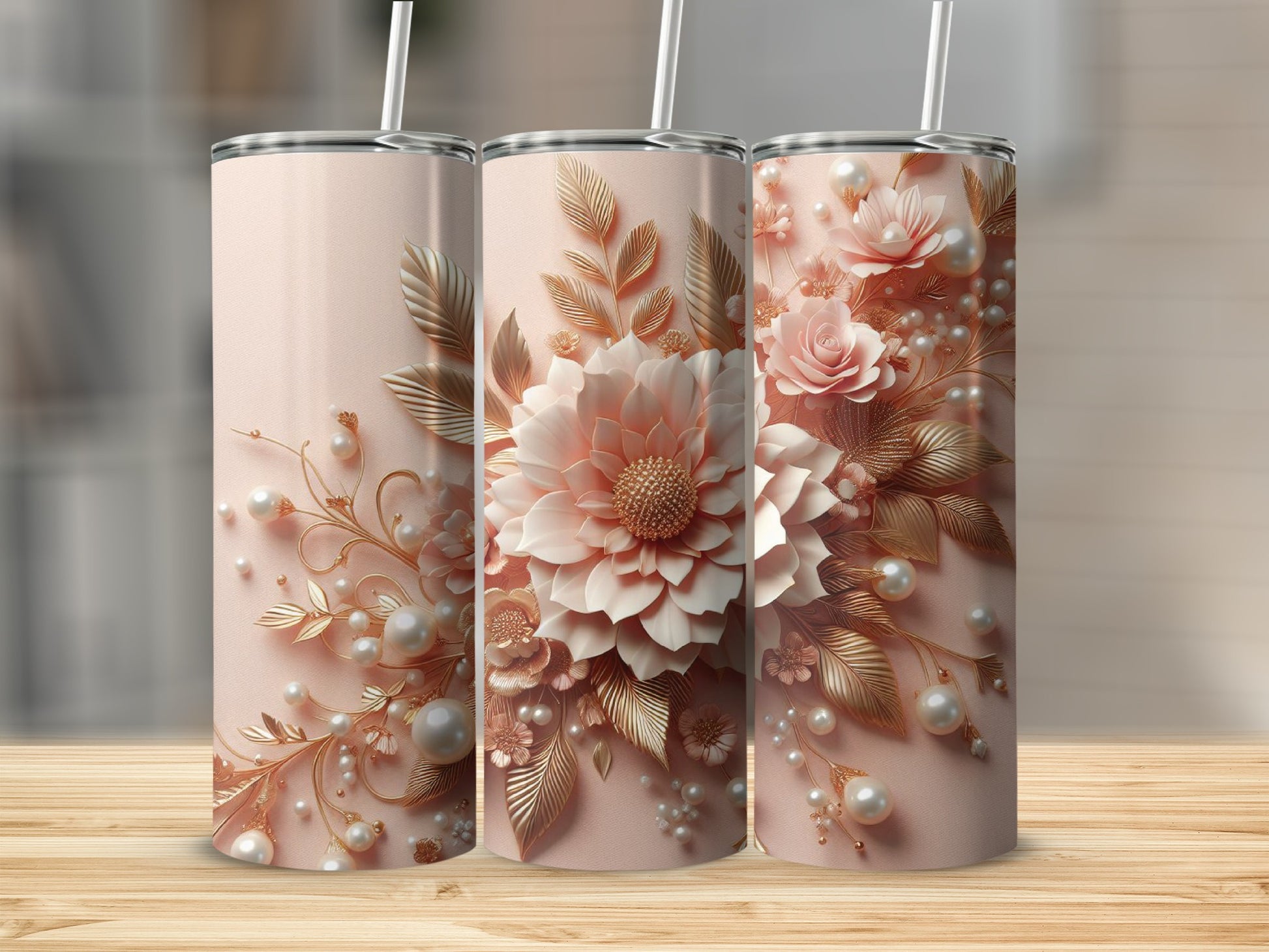 Pink floral and pearl patterned tumbler with straw on wooden surface.