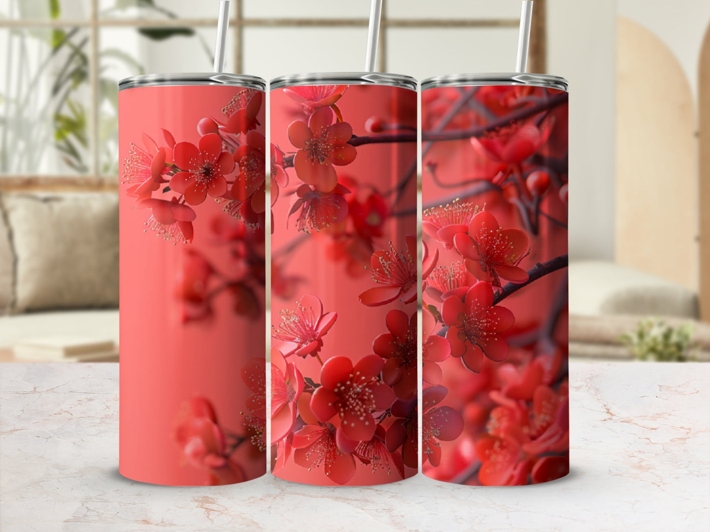 Three coral tumblers with cherry blossom floral print.