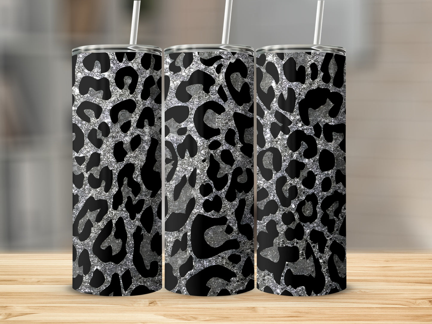 Three tall tumblers with a silver glitter leopard print pattern.