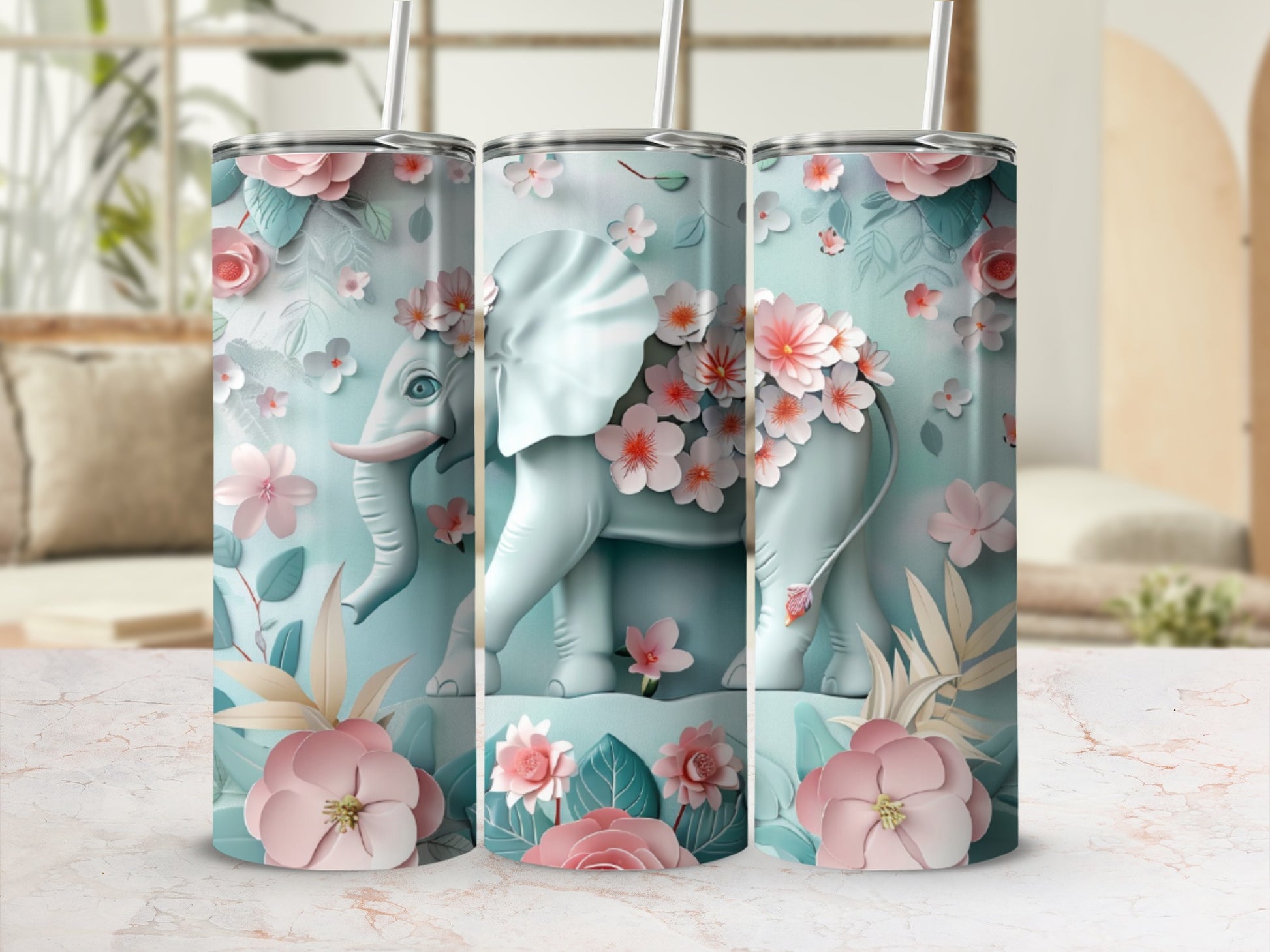 Three tumblers with a light blue elephant and pink floral design.
