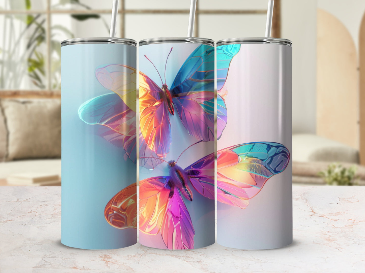 Three tumblers with iridescent butterfly designs in a light-filled setting.
