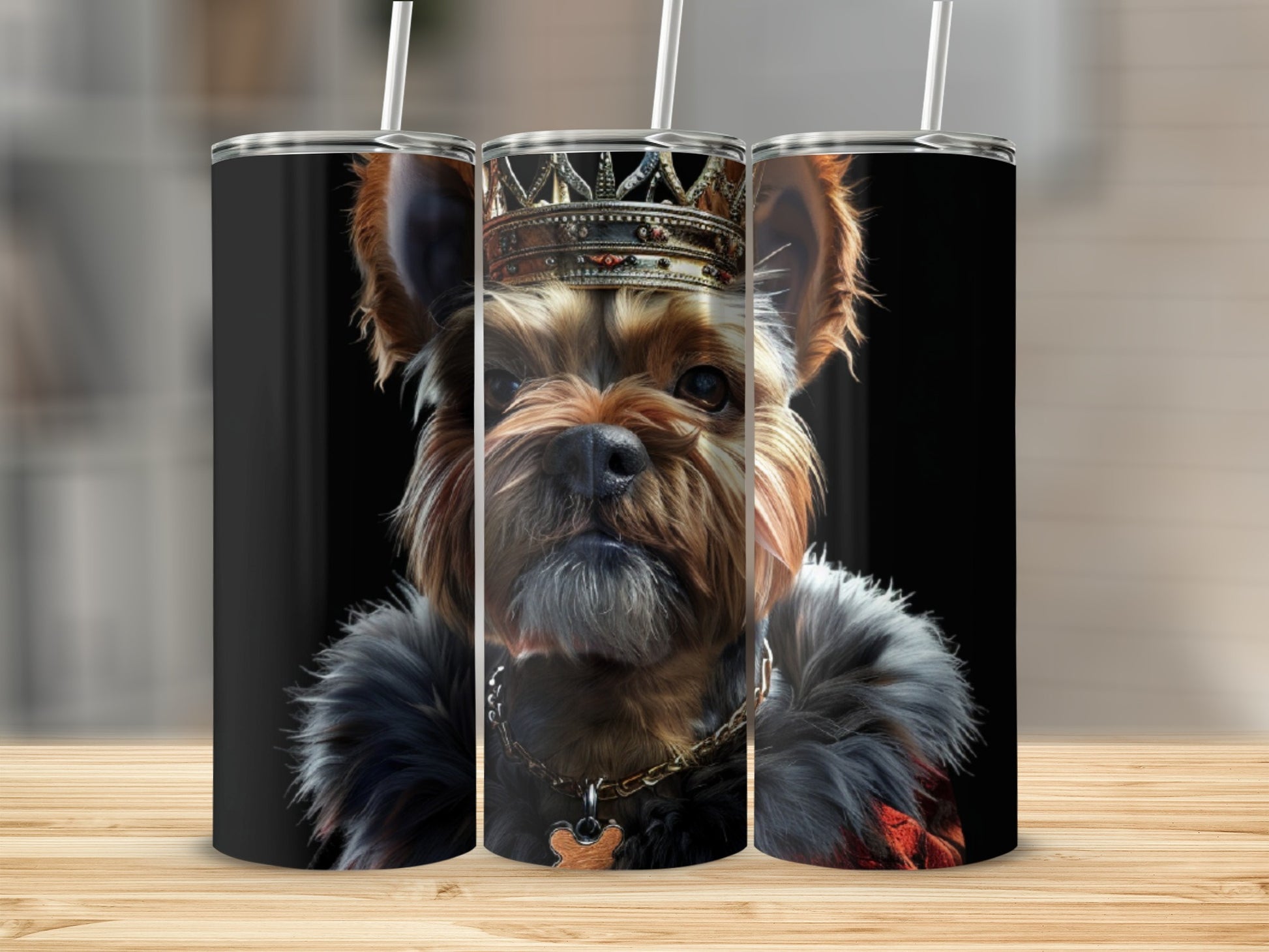 Yorkshire Terrier wearing crown and fur collar, on tumblers.