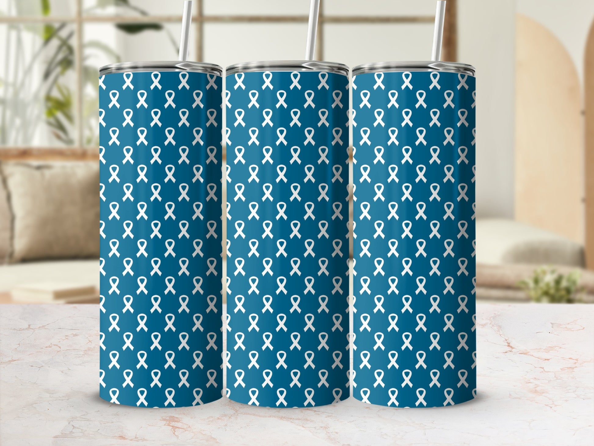 Three blue tumblers with a pattern of white awareness ribbons.