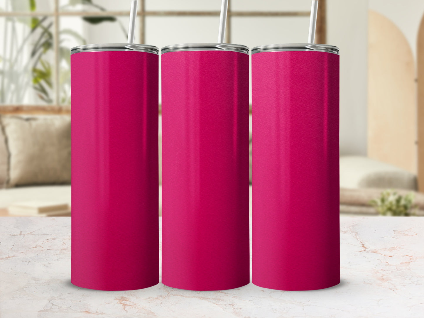 Three solid magenta tumblers with straws stand on a marble surface.