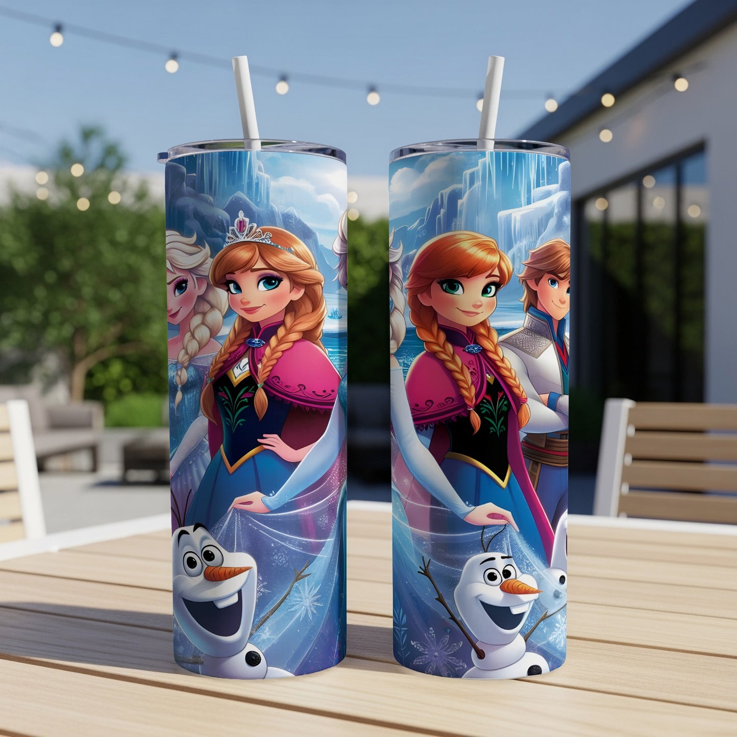 Two tumblers featuring Anna, Elsa, and Olaf from Frozen on a patio table.