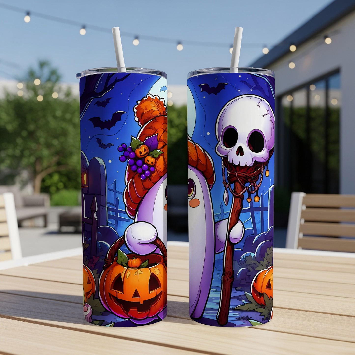 Two tumblers with Halloween ghost and skull designs on a table.