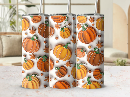Three tumblers with a repeating pattern of orange pumpkins and autumn leaves.