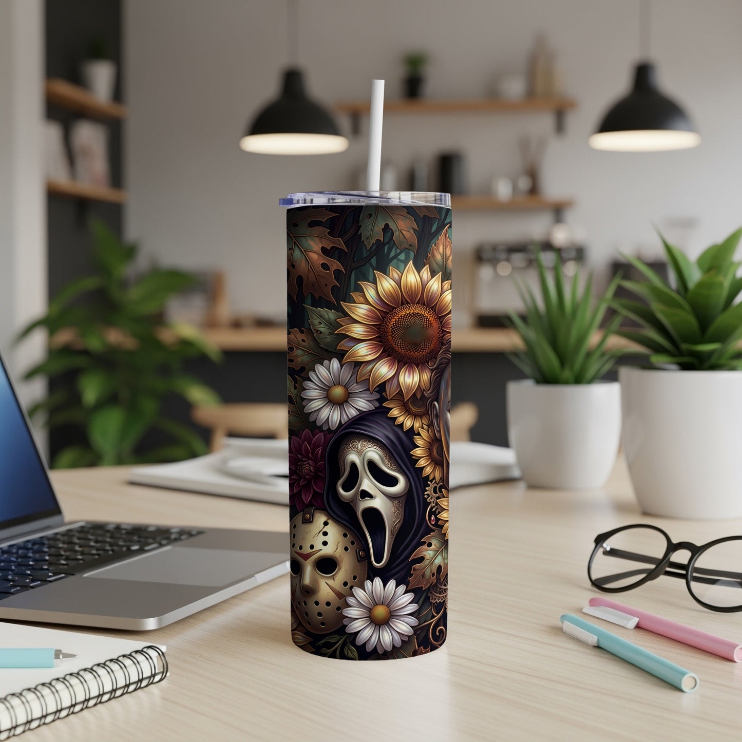 Tumbler with ghost face, hockey mask, sunflowers, and autumn leaves design.