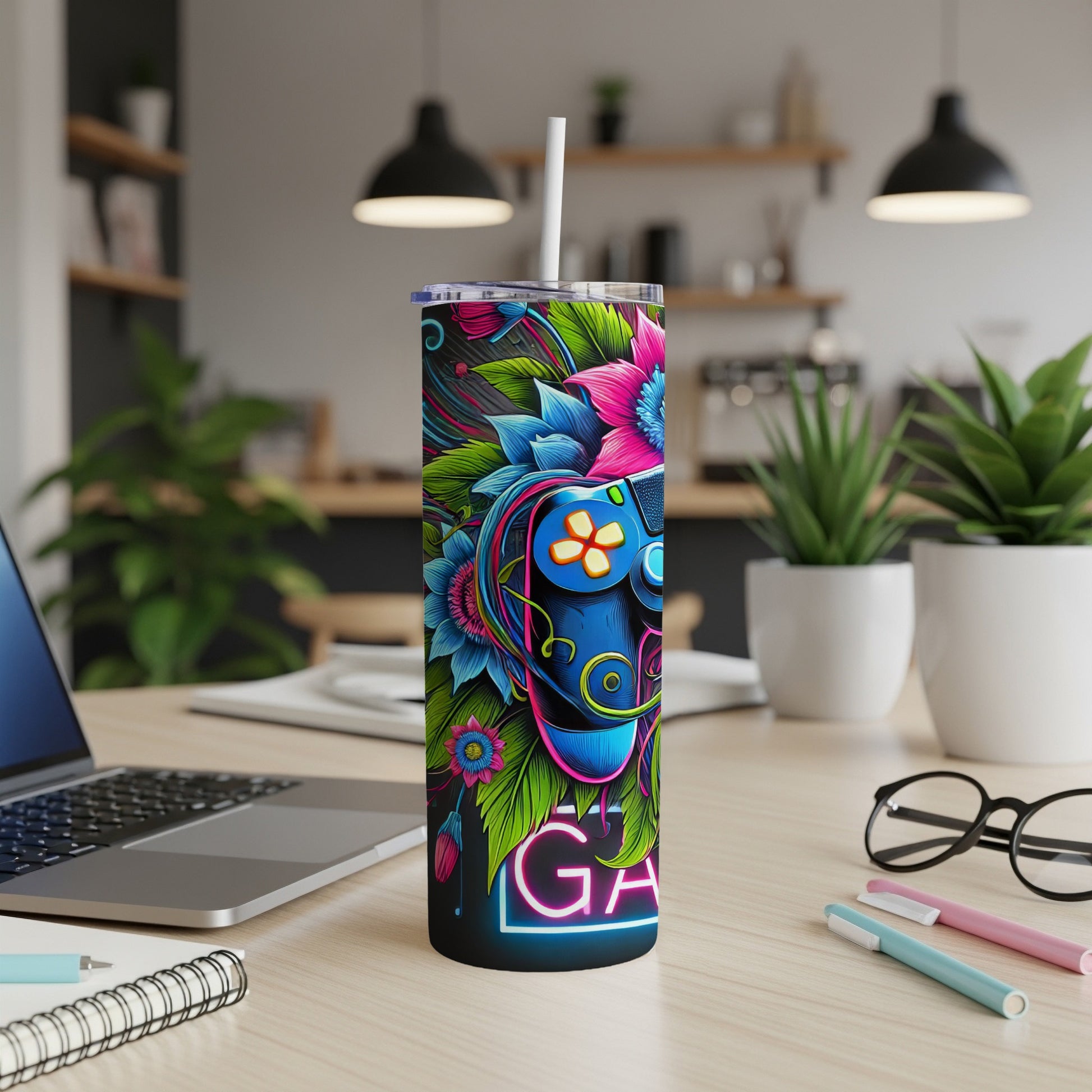 Gamer tumbler with colorful floral controller design and "GAME" text.