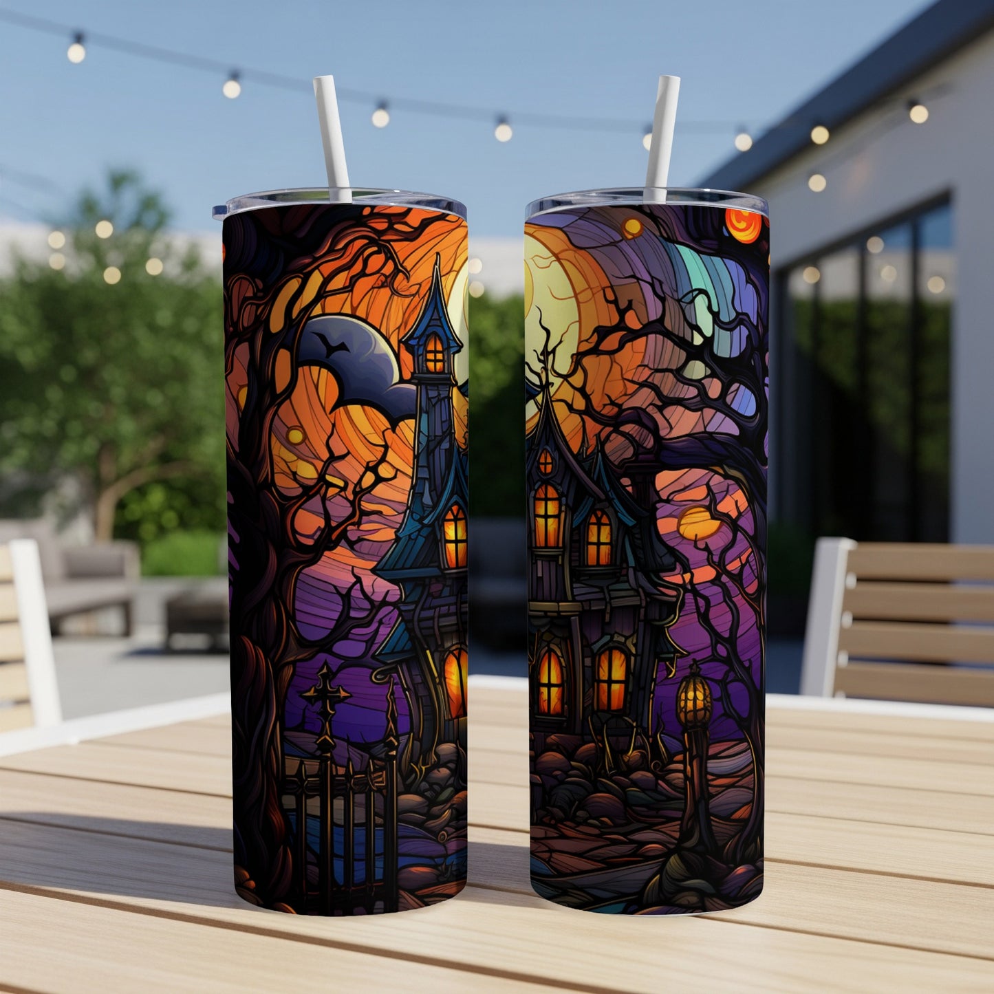 Two tumblers with a spooky, colorful haunted house Halloween scene.