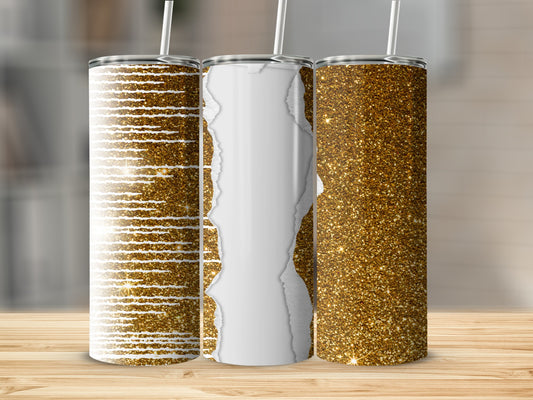 Three glitter tumblers with unique designs on a wooden surface.