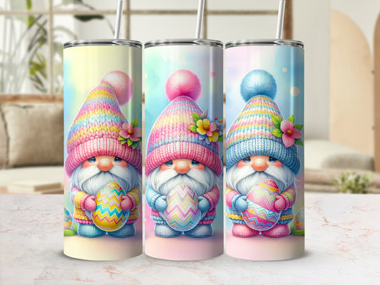 Three gnomes in colorful hats holding decorated Easter eggs.