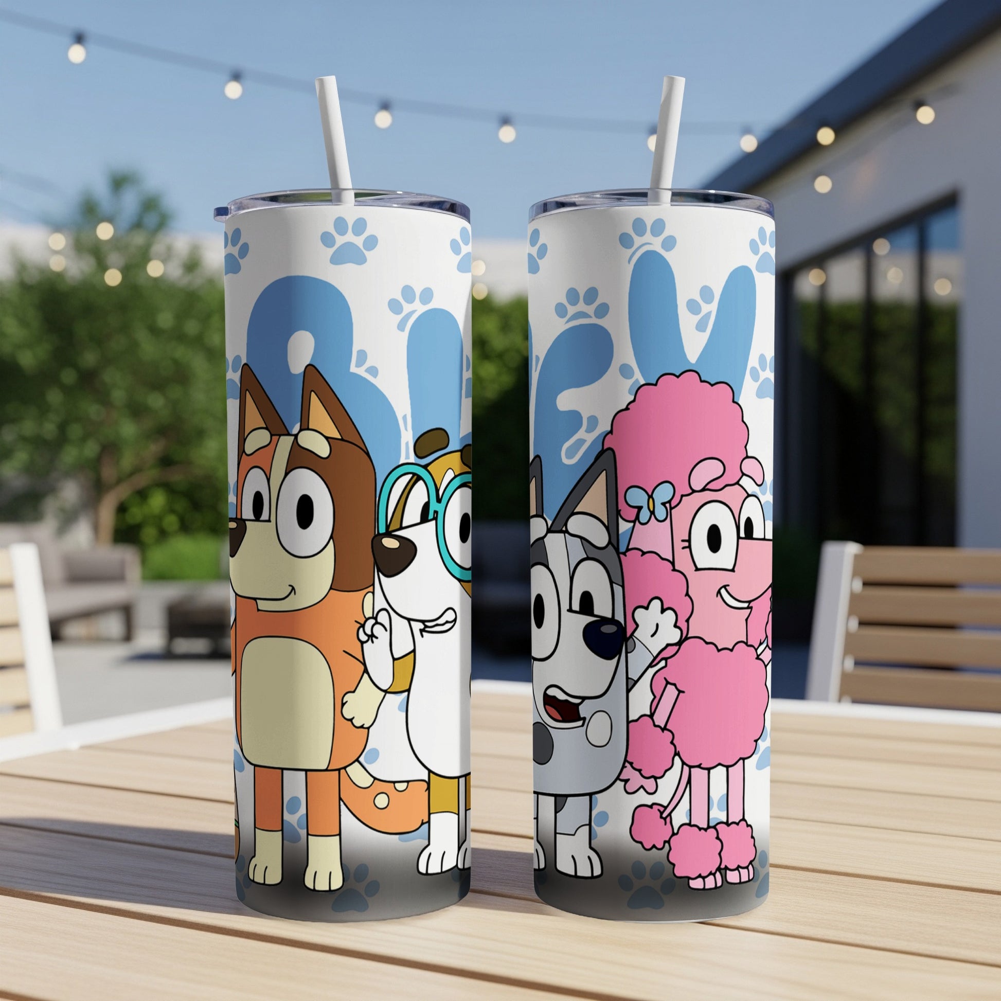 Bluey characters Bandit, Bluey, and Bingo on a white tumbler with blue paw prints.