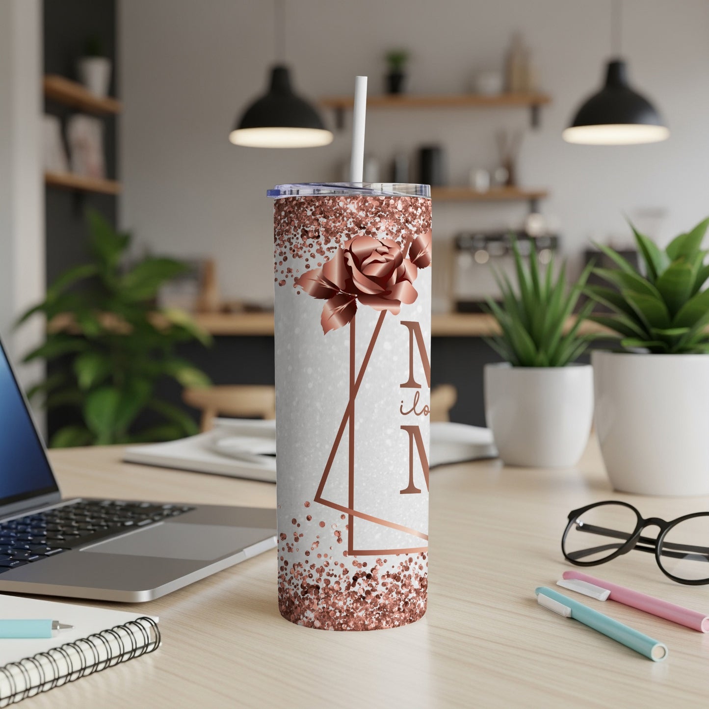 White tumbler with rose gold glitter and floral design, "N" initial.