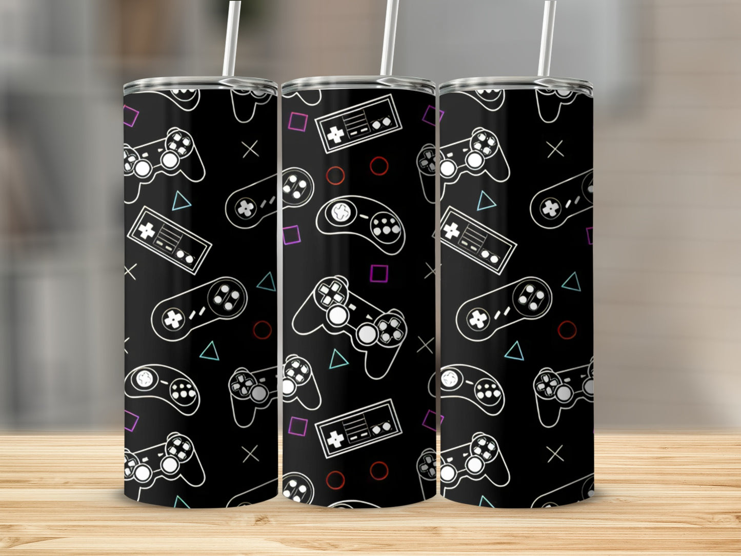 Black tumbler with repeating pattern of white gaming controllers and buttons.
