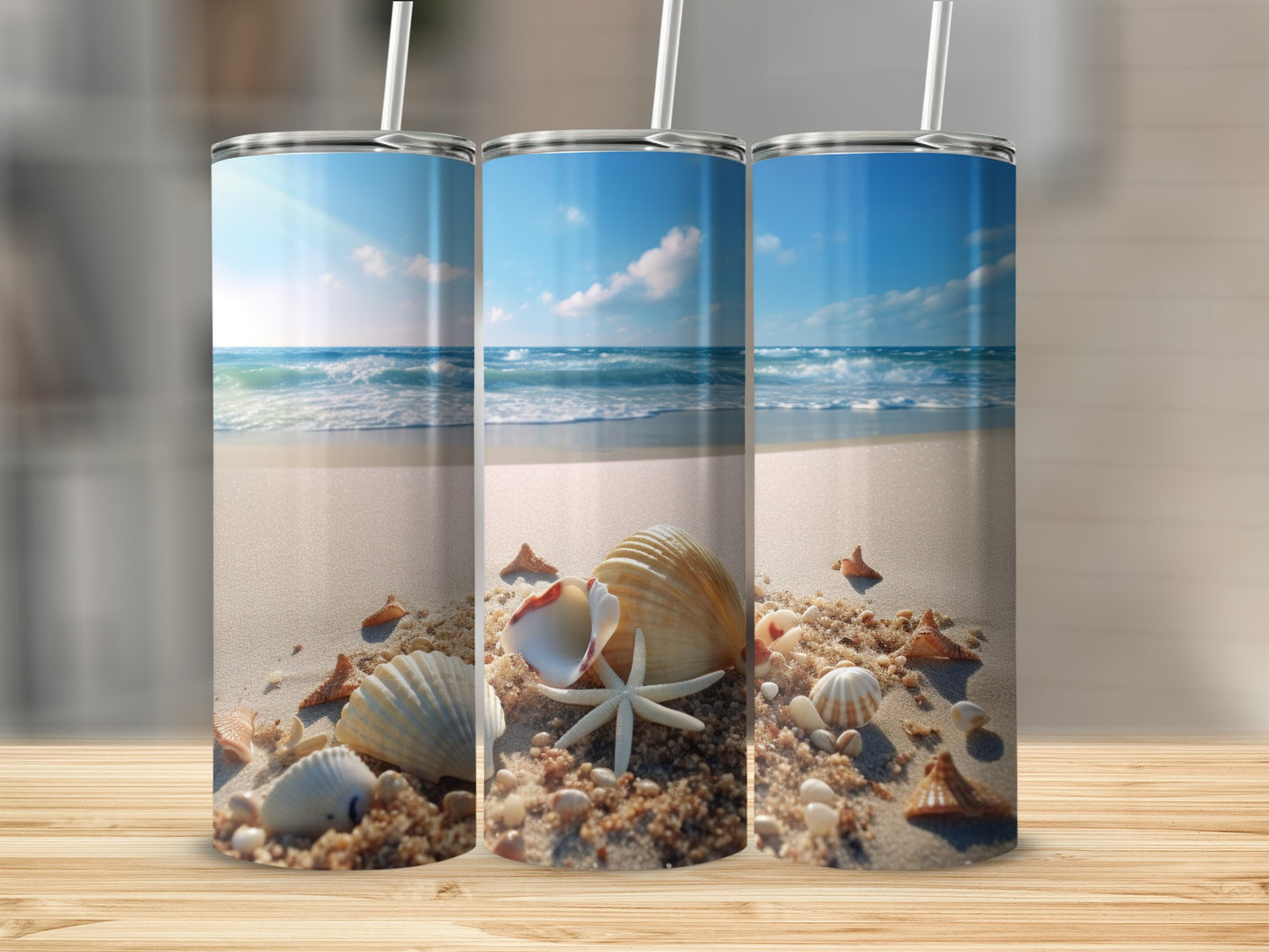 Three tumblers featuring a beach scene with shells and starfish.