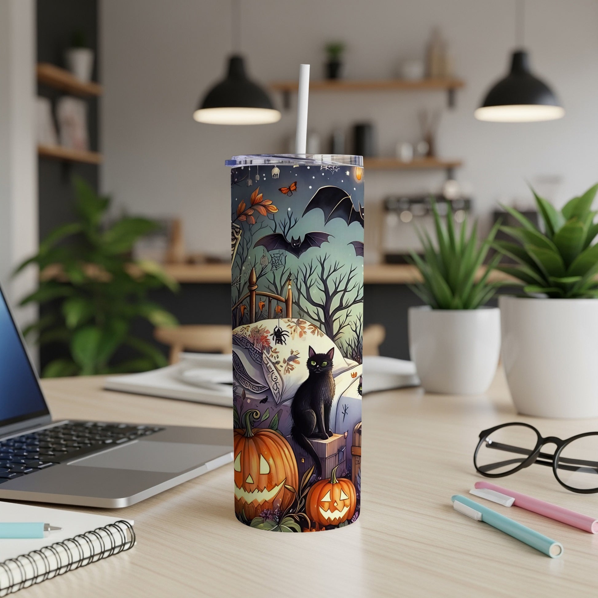 Tumbler with Halloween scene: black cat, pumpkins, bats, and spooky trees.
