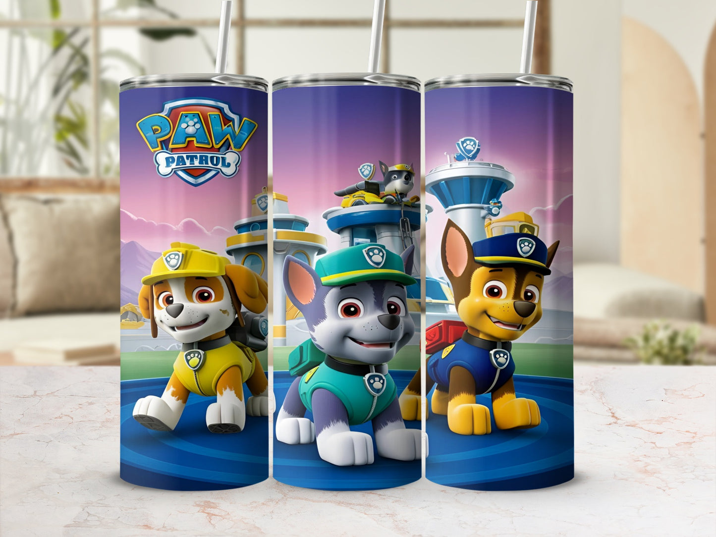 Paw Patrol characters Chase, Marshall, and Rubble on a blue tumbler.