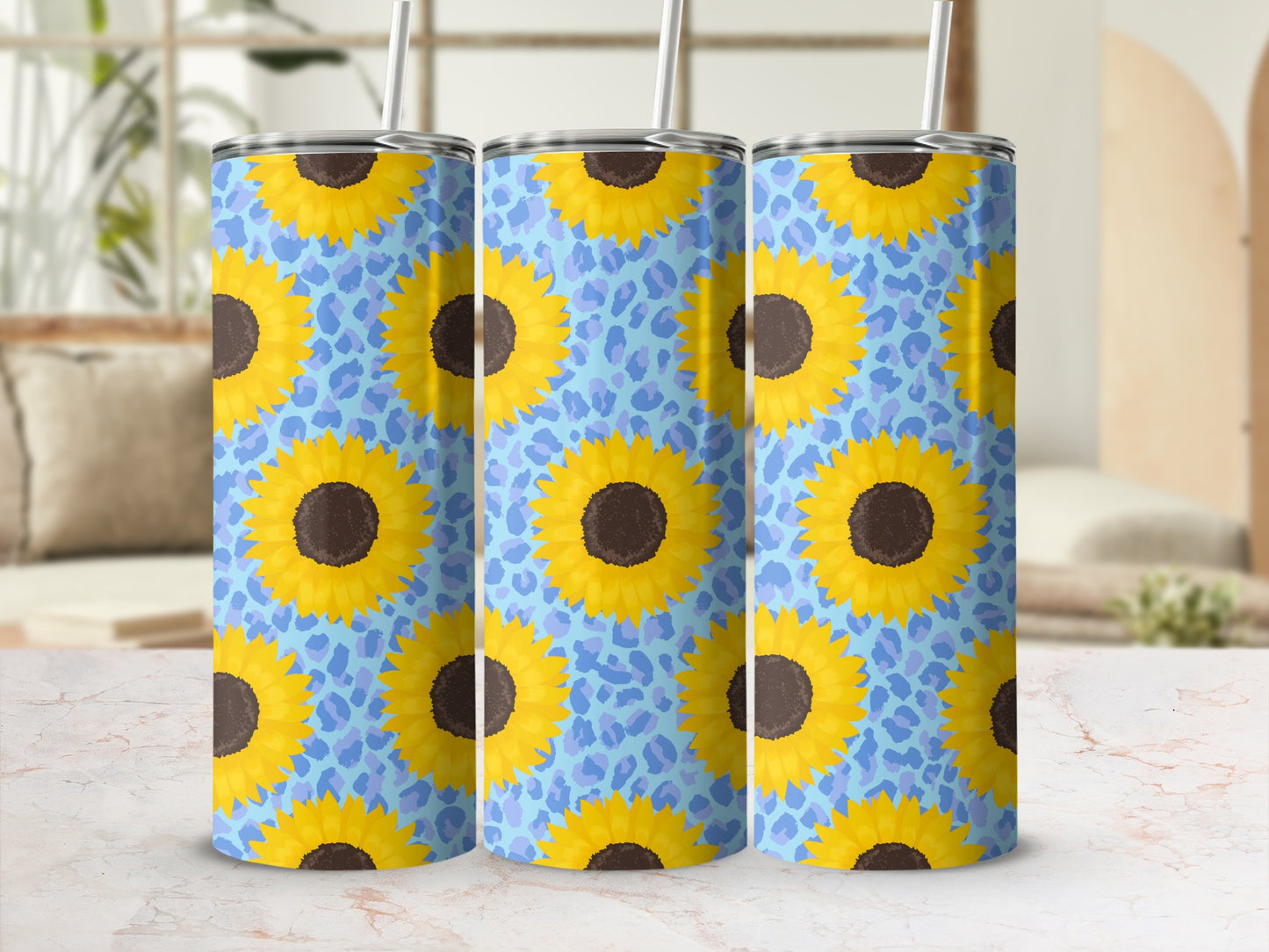 Three tumblers with a sunflower and blue leopard print design.
