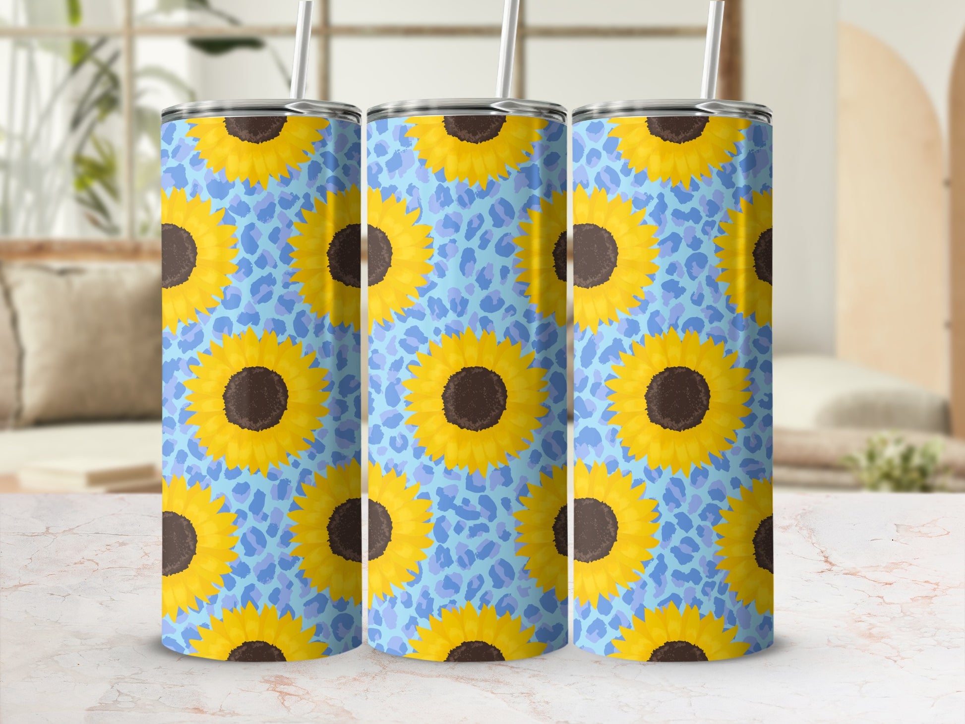 Three tumblers with a sunflower and blue leopard print design.