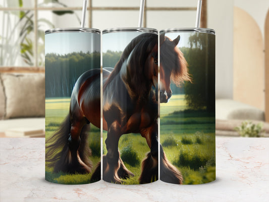 Brown horse with flowing mane and tail stands in a grassy field.