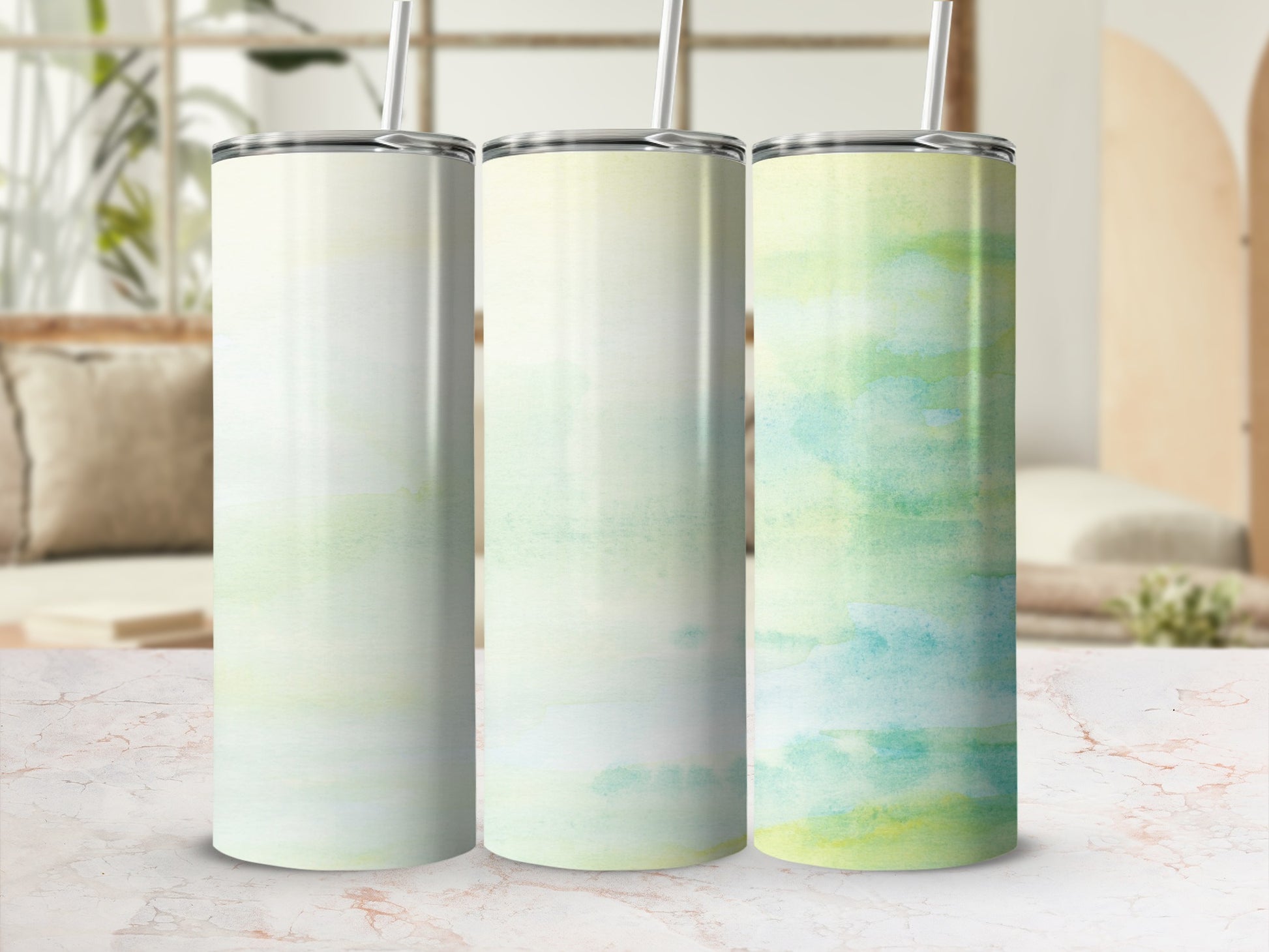Three tumblers with watercolor-style green and yellow abstract designs.