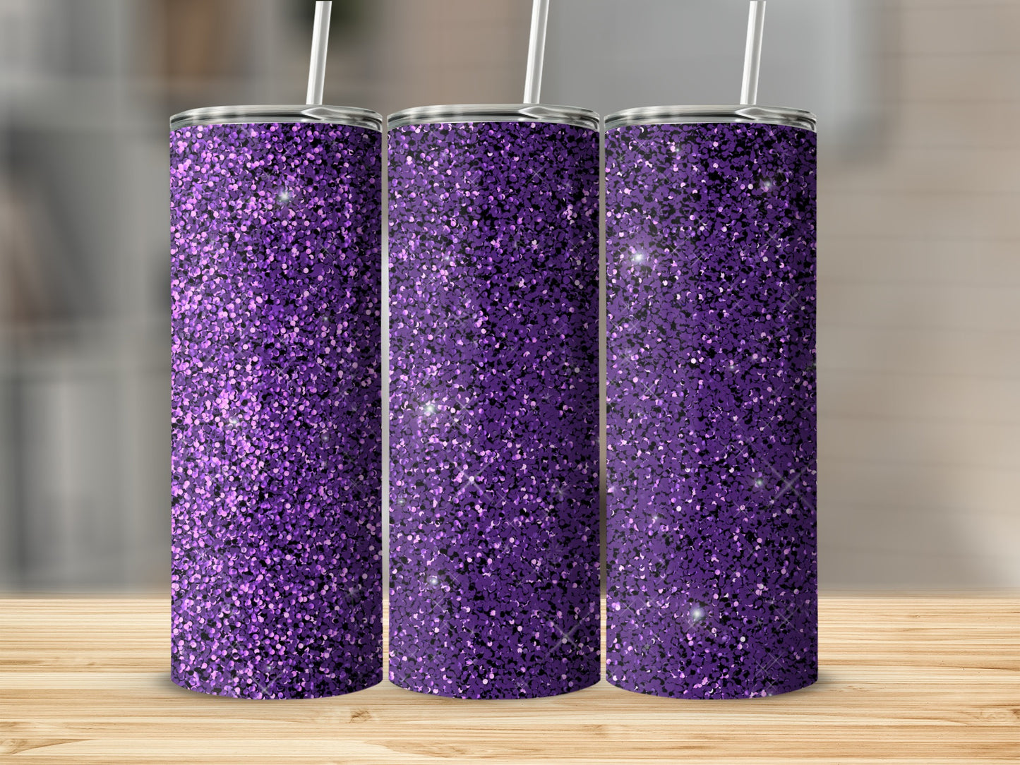 Three tall tumblers with purple glitter design and straws.